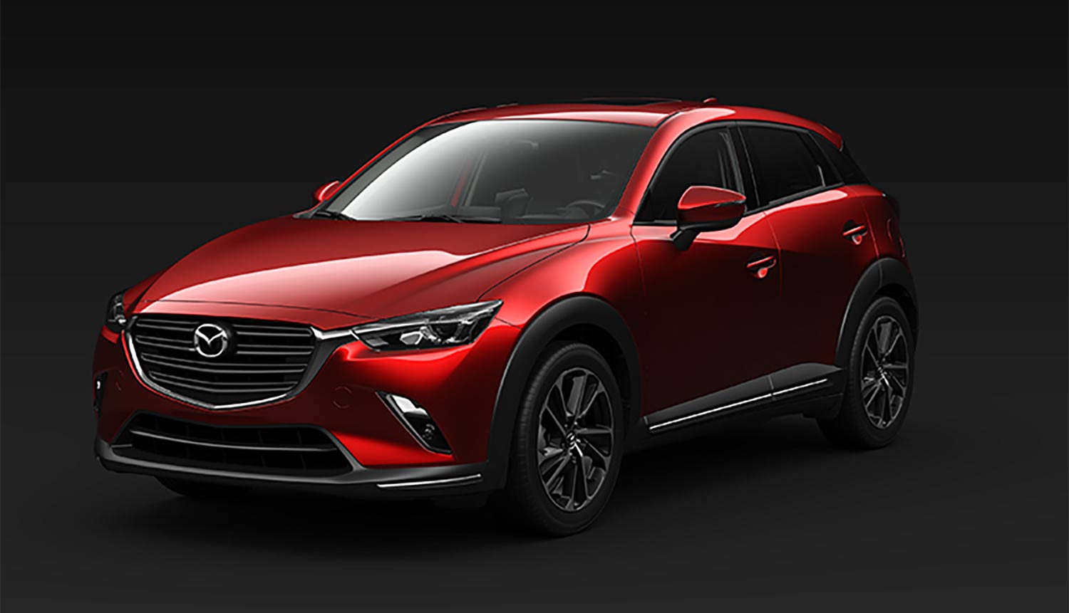 Mazda CX3 2024 en México diseño exterior color rojo, frontal con faros y nuevos rines de 18